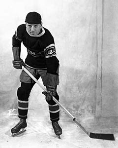 Aurele Joliat wearing his trademark black cap while as a member of the Montreal Canadiens.