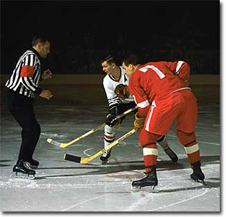 Stan Mikita and Norm Ullman face off