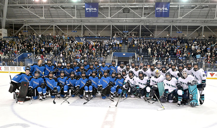 Teams Toronto and New York pose for a photo following the inaugural PWHL game at the Mattamy Athletic Centre in Toronto on Monday, January 1, 2024. Credit: Dan Hamilton