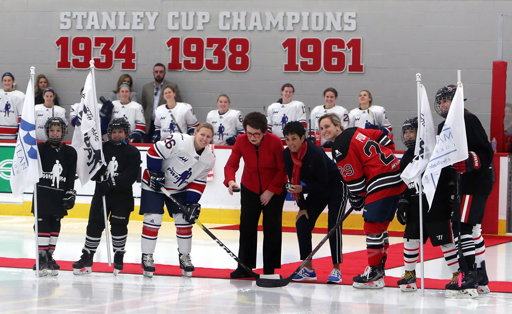 Billie Jean King and Illona Kloss drop the puck at the PWHPA’s Dream Gap Tour Megellan Showcase in Chicago, Il, with Kendall Coyne Schofield of Team Granato and Marie-Philip Poulin of Team Hefford. (Photo by Paul Stinsa/Hockey Hall of Fame).