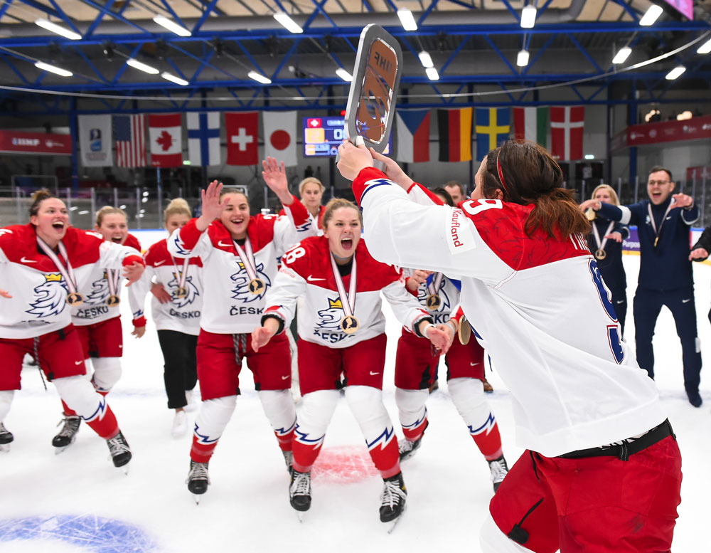 Alena Mills and Team Czechia celebrate a historic bronze medal at the IIHF Ice Hockey Women’s World Championship. Credit: Matt Zambonin