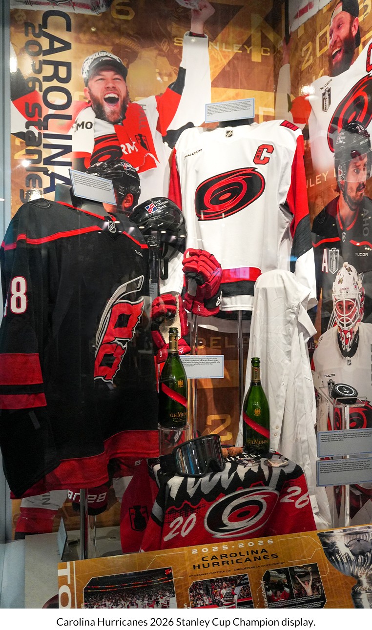 Featured in the Hockey Hall of Fame's Hyundai NHL Zone is an extensive display dedicated to the 2026 Stanley Cup Champion Carolina Hurricanes. This display highlights game-worn artifacts and memorabilia from the Stanley Cup Final showcasing the franchise’s back-to-back championship.